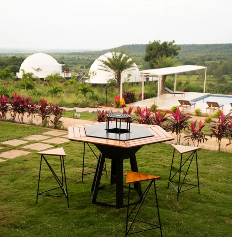 Barbecue table on the lawn above the pool