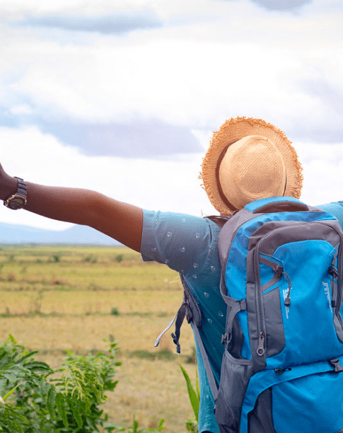 Guest with arms wide over the fields